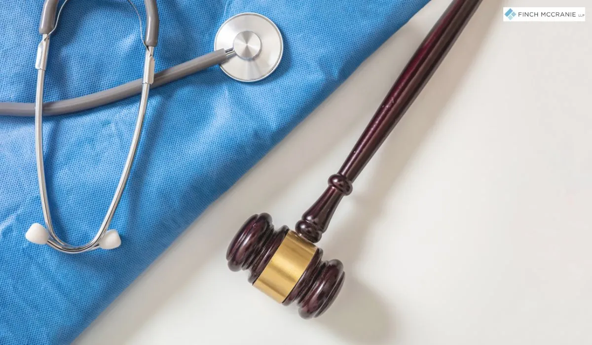 Scales of justice and a gavel symbolizing legal support for medical malpractice cases.